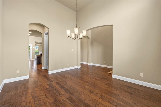 1555 Sonnet Dr, Heath, TX 75126 - kitchen with stainless steel dishwasher, a sink, dark wood-style flooring, a lit fireplace, and light stone countertops