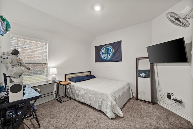 bedroom with lofted ceiling and light colored carpet