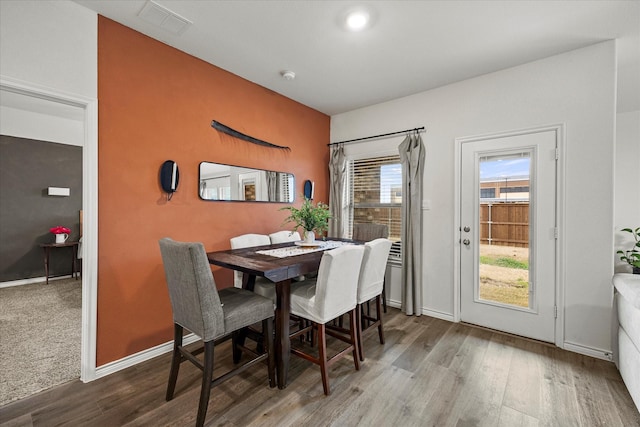 dining space featuring hardwood / wood-style flooring