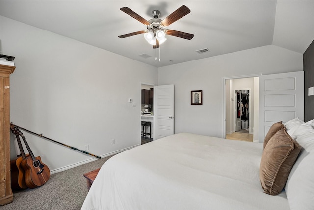 carpeted bedroom featuring lofted ceiling and ceiling fan