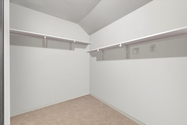 126 Condor Pass, Caddo Mills, TX 75135 - spacious closet featuring carpet floors and lofted ceiling