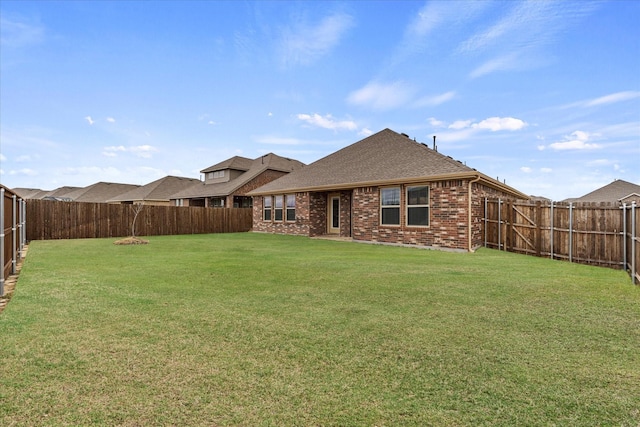 126 Condor Pass, Caddo Mills, TX 75135 - back of house featuring brick siding and roof with shingles