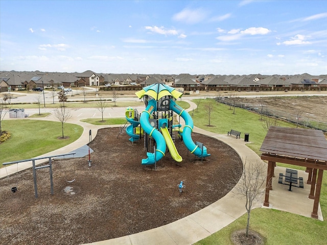 view of jungle gym featuring a lawn