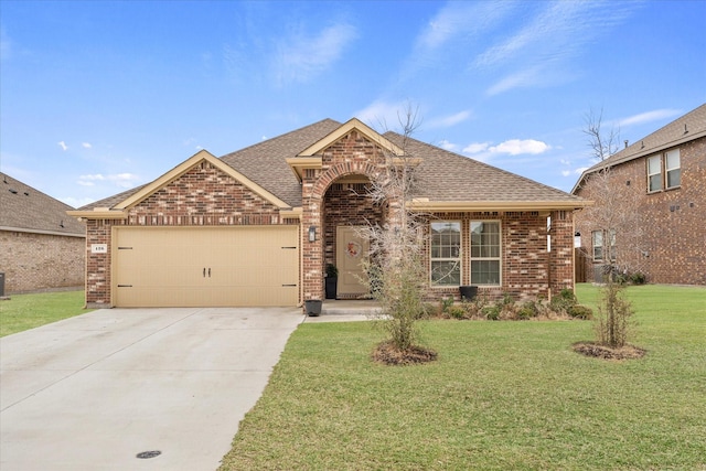 126 Condor Pass, Caddo Mills, TX 75135 - view of front of home with brick siding, a garage, a front lawn, roof with shingles, and driveway