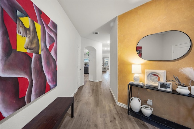 126 Condor Pass, Caddo Mills, TX 75135 - corridor featuring arched walkways, wood finished floors, and baseboards