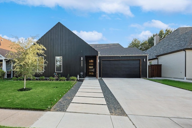 modern inspired farmhouse featuring a garage and a front yard