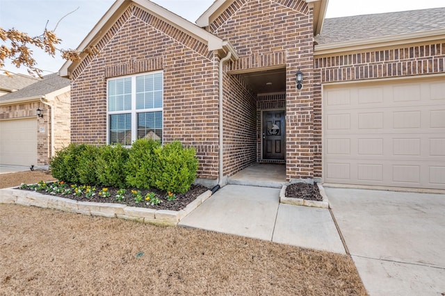 property entrance with a garage