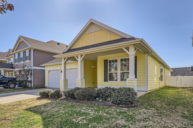 view of front of house featuring a garage and a front yard