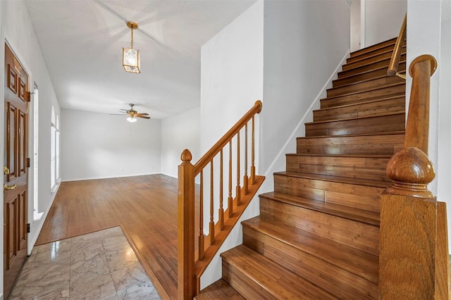 interior space featuring ceiling fan