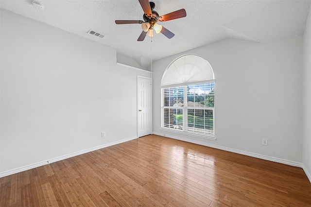 unfurnished room featuring hardwood / wood-style floors, a textured ceiling, and ceiling fan