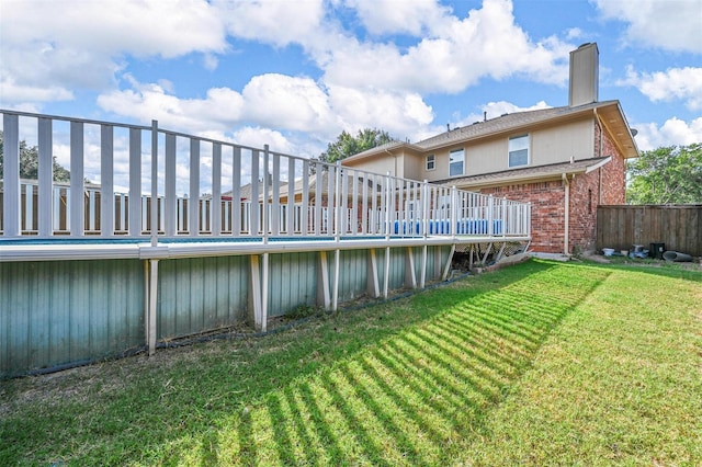 2305 Buckeye Dr, Mesquite, TX 75181 - rear view of house featuring brick siding, a deck, and a chimney