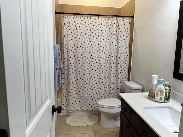 full bath featuring toilet, tile patterned flooring, and vanity