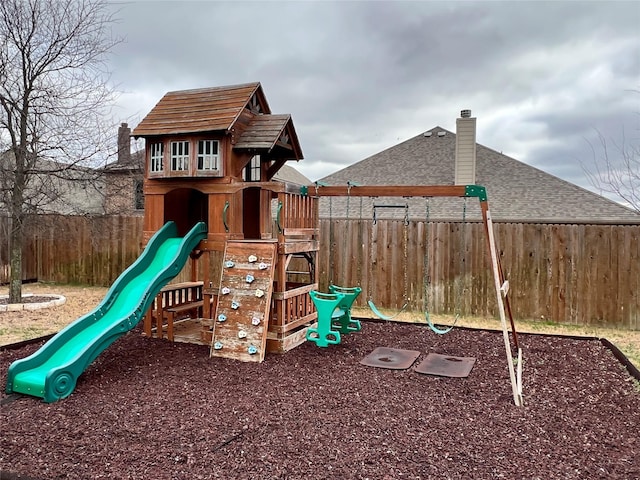 view of playground featuring fence