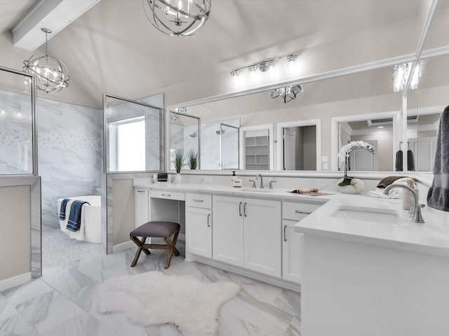 bathroom with a shower, vaulted ceiling, vanity, and a chandelier