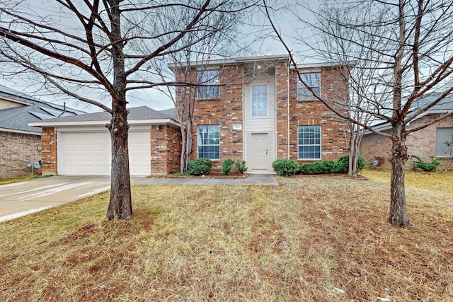 view of front of property with a garage and a front lawn