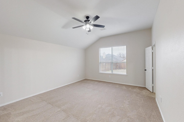 additional living space with lofted ceiling, light carpet, and ceiling fan