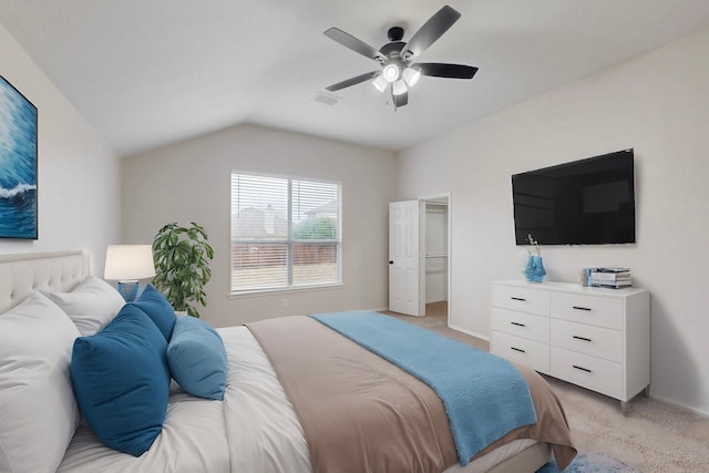 bedroom with lofted ceiling, light colored carpet, and ceiling fan