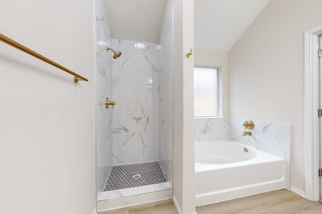 bathroom with hardwood / wood-style floors and independent shower and bath