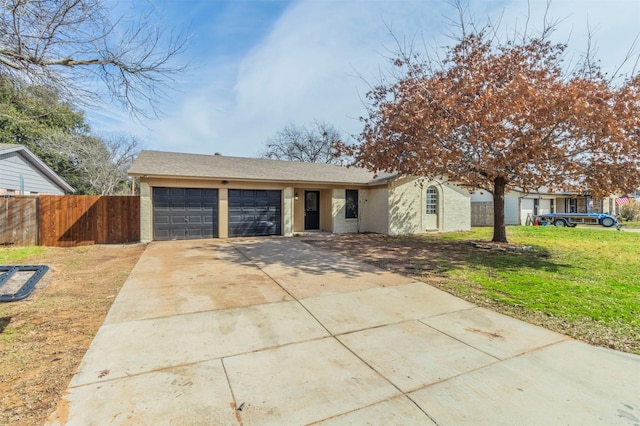 single story home with a garage and a front yard