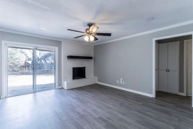 unfurnished living room featuring crown molding, dark hardwood / wood-style flooring, and a fireplace