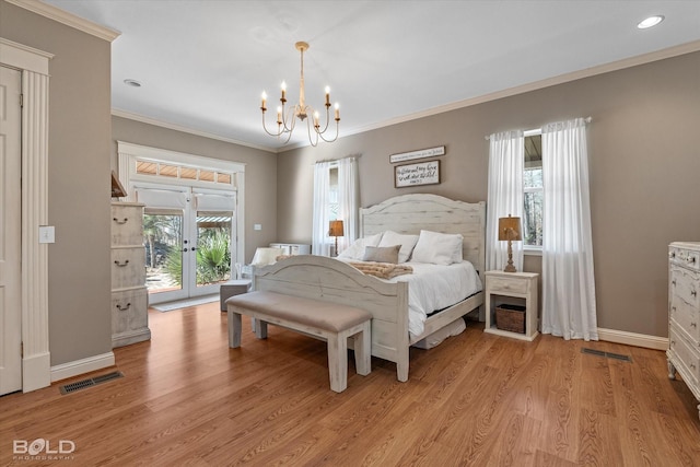 bedroom featuring light wood-style floors, crown molding, a notable chandelier, and baseboards