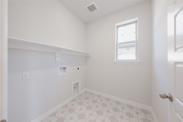 clothes washing area featuring visible vents, hookup for a gas dryer, laundry area, electric dryer hookup, and light floors