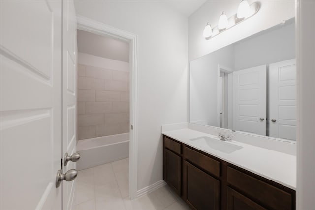 bathroom with tile patterned flooring, baseboards, and vanity