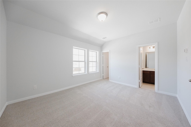 unfurnished bedroom with visible vents, baseboards, and light carpet