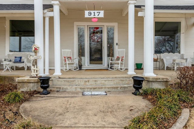 entrance to property featuring covered porch