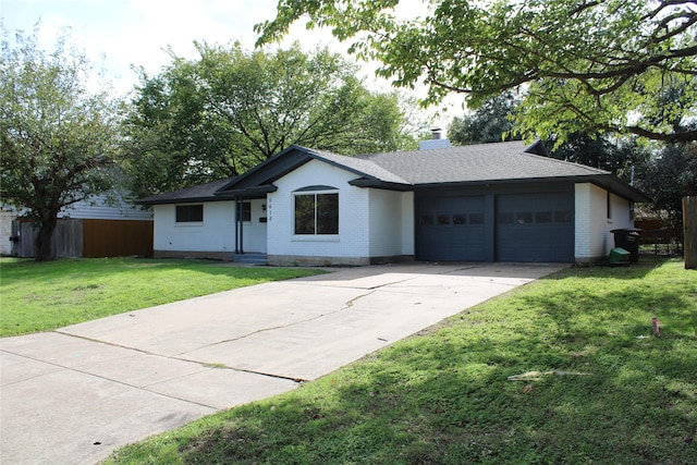 ranch-style house with a garage and a front yard