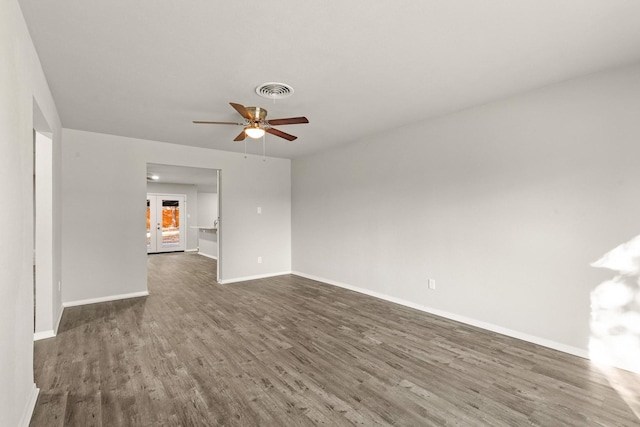 unfurnished room featuring ceiling fan and dark hardwood / wood-style floors