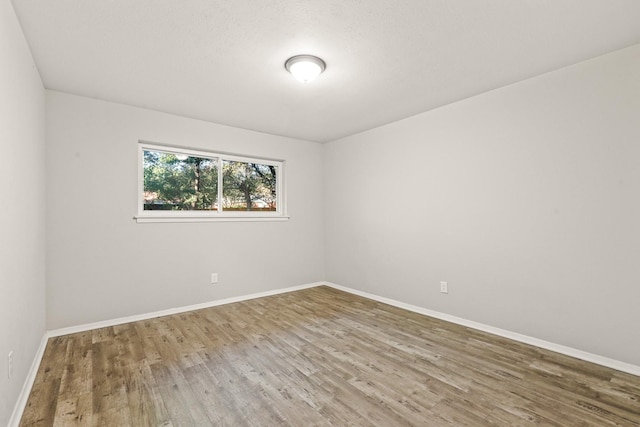 empty room featuring hardwood / wood-style flooring