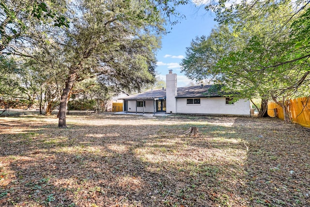 rear view of house featuring a patio area