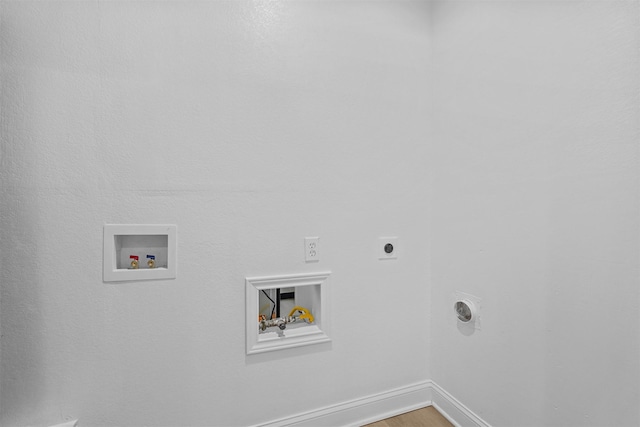 laundry area featuring hardwood / wood-style floors, electric dryer hookup, and washer hookup