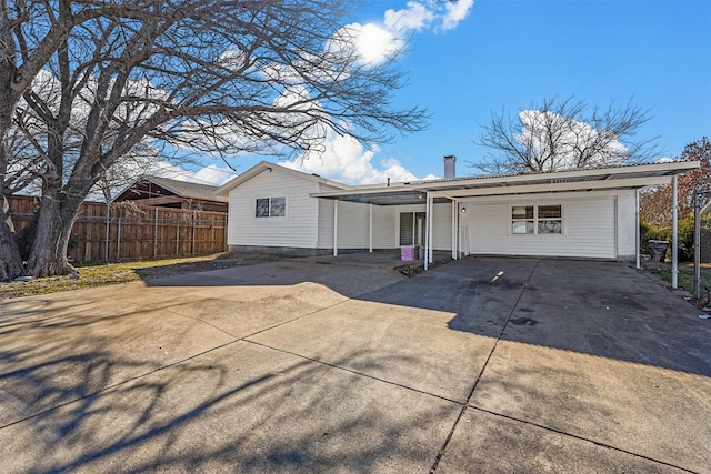 ranch-style home with a carport