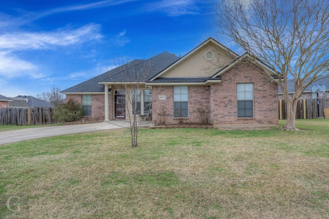 ranch-style home featuring a front yard