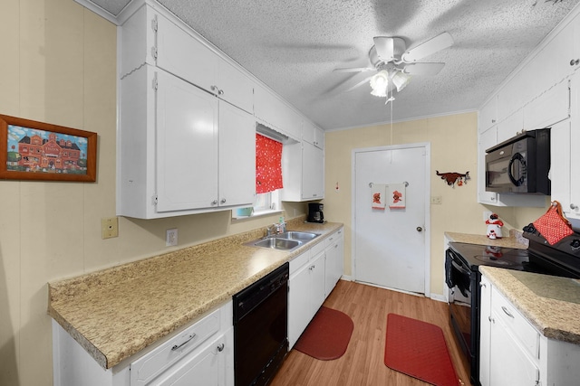 kitchen with sink, white cabinetry, a textured ceiling, light wood-type flooring, and black appliances