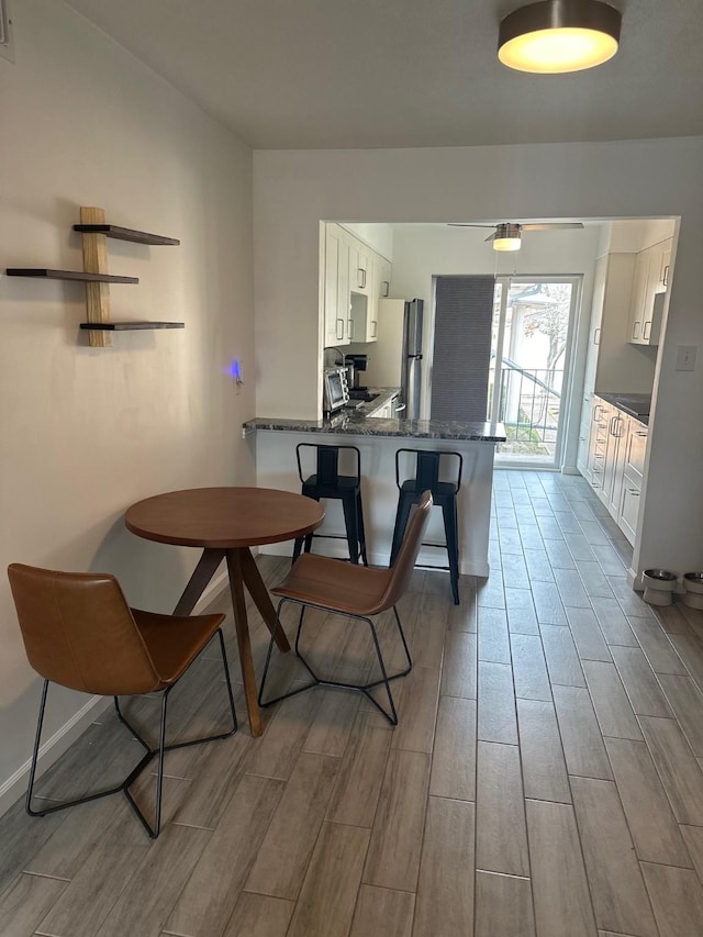 dining space featuring ceiling fan