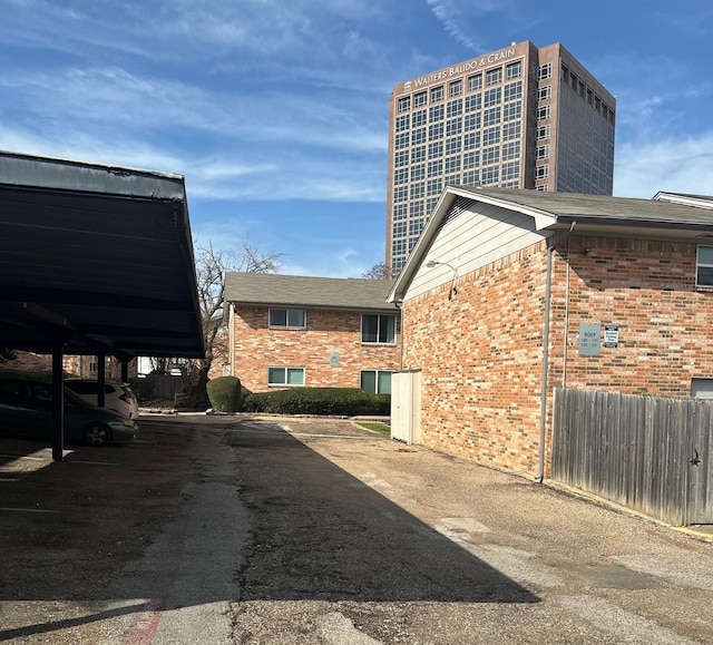 view of home's exterior with a carport