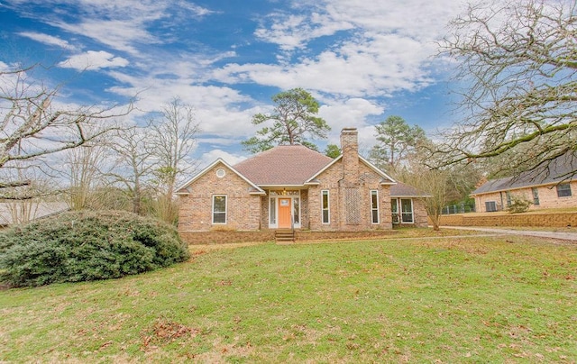 ranch-style house featuring a front yard