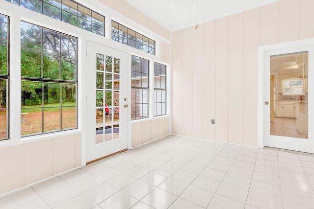 unfurnished sunroom featuring plenty of natural light