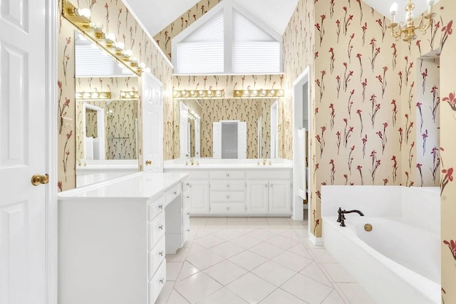 bathroom featuring tile patterned floors, vanity, and a bathtub