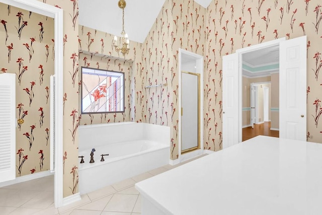 bathroom with independent shower and bath, tile patterned flooring, and a notable chandelier