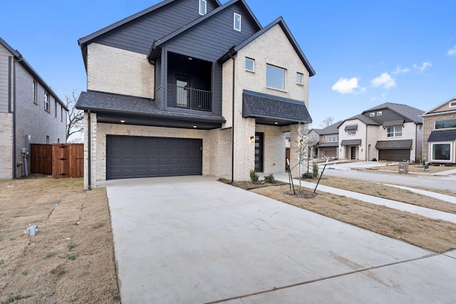 view of front of property with a garage and a balcony