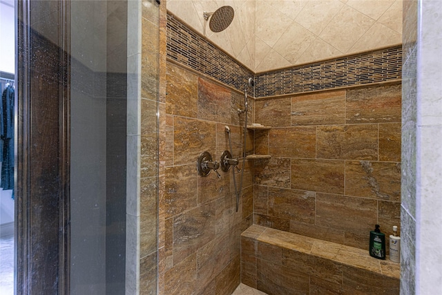 bathroom with a tile shower