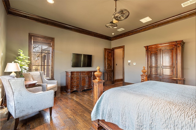 bedroom with crown molding and dark hardwood / wood-style floors