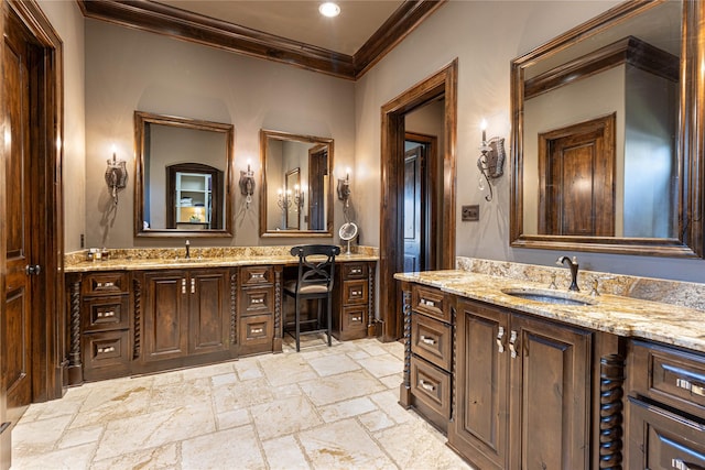 bathroom featuring ornamental molding and vanity