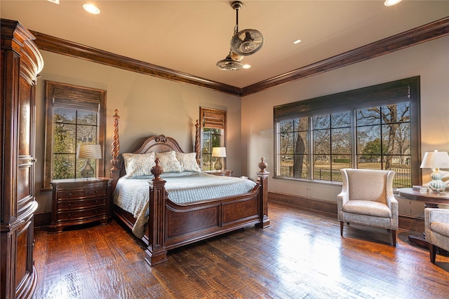 bedroom with ornamental molding and dark hardwood / wood-style floors