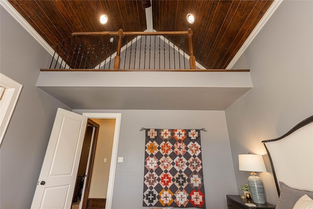 interior space featuring wood ceiling, crown molding, and high vaulted ceiling