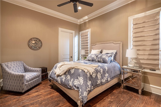 bedroom with dark hardwood / wood-style flooring, crown molding, and ceiling fan